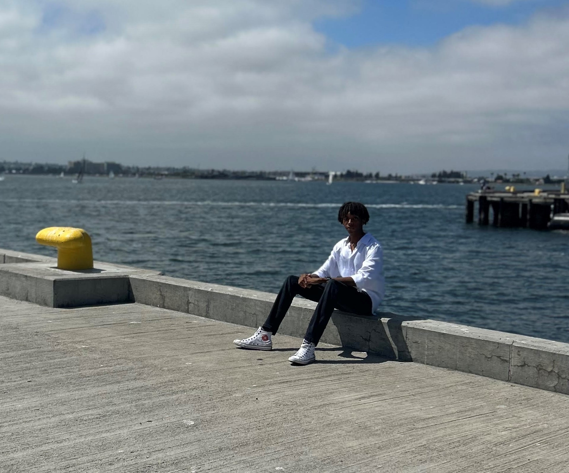 Person enjoying serene waterfront view.